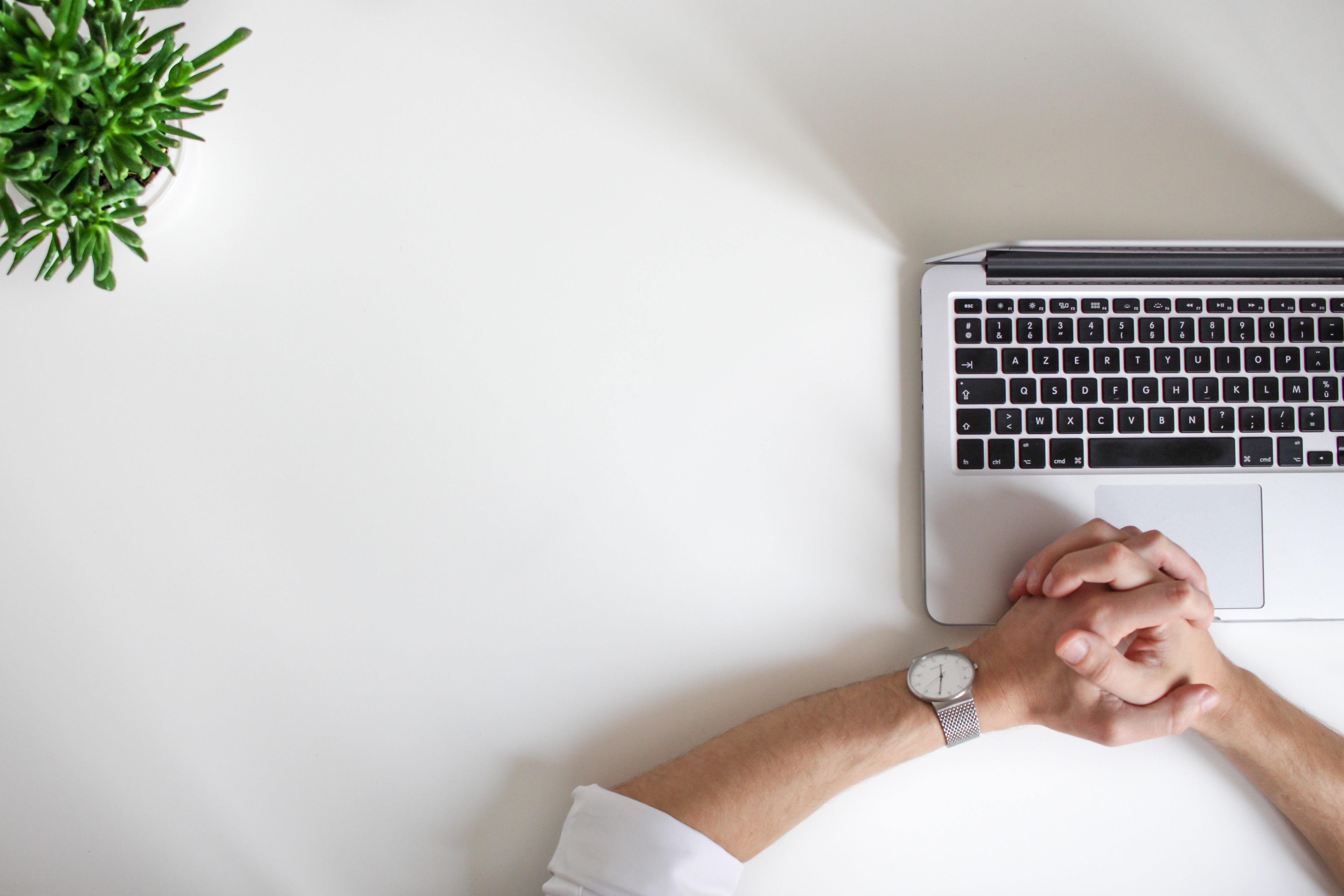 Man at desk with thought of Cloud Application Acronyms
