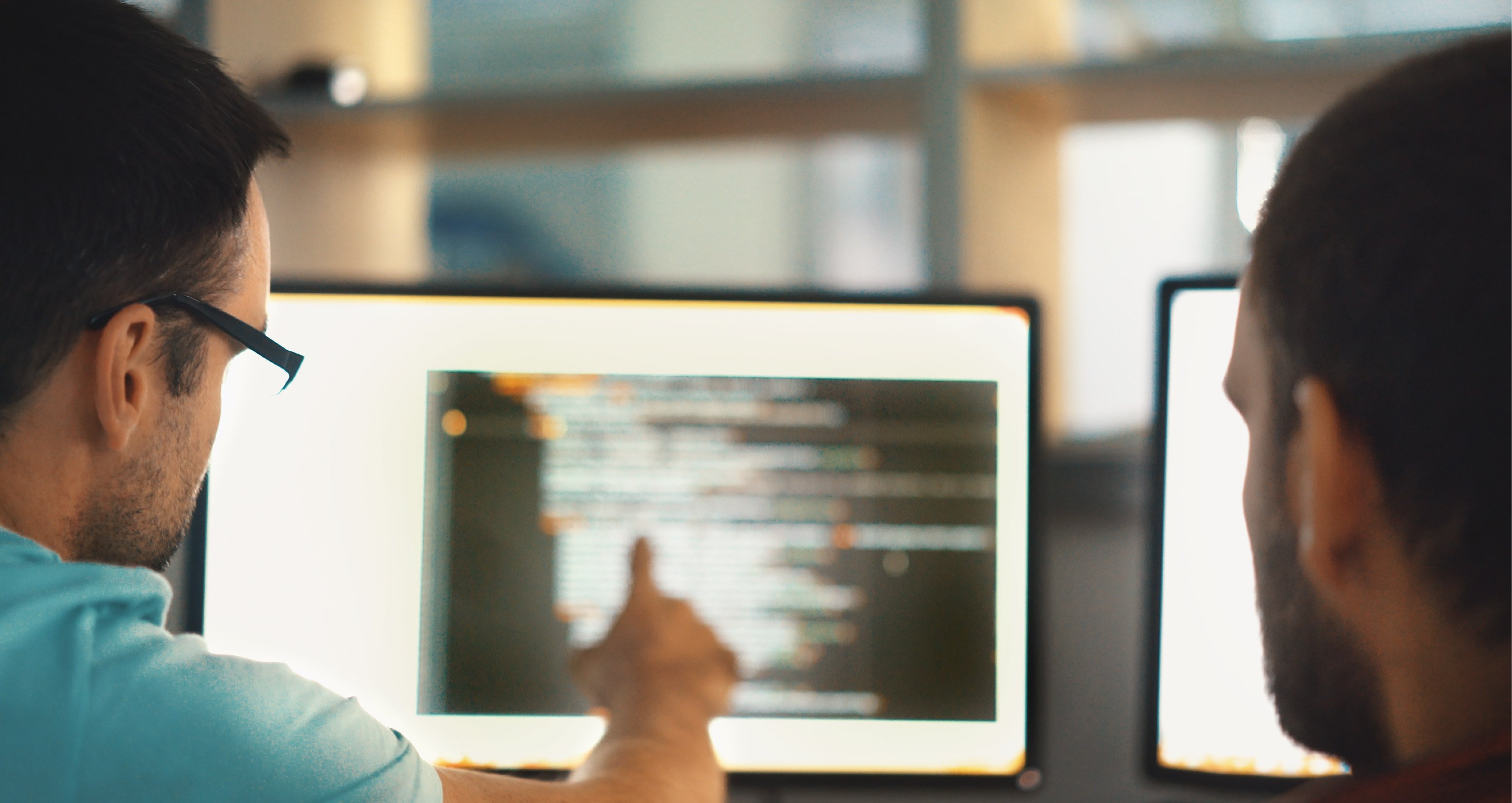 Men looking at how to choose a pen test provider