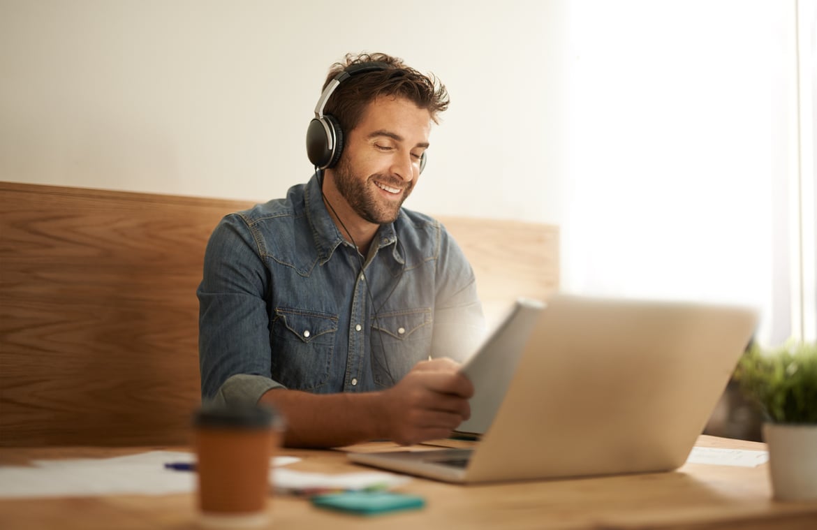 The Journey of a New User device man with laptop listening to music